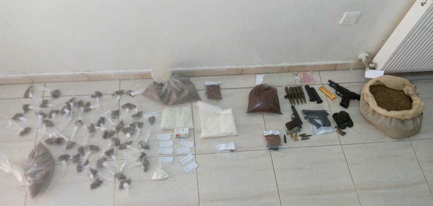 Drugs seized by Anti-Narcotics Department personnel after raiding nine houses in Sahab on Tuesday (Petra photo)